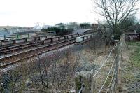 Auchinleck looking west to the station from the former junction for Muirkirk. There was originally an engine shed in the v of the junction. The bridge over the road has been altered since closure of the Muirkirk line.<br><br>[Ewan Crawford 20/02/2005]