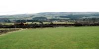 PW train heads south at Auchinleck. Viewed from the trackbed of the former Muirkirk line.<br><br>[Ewan Crawford 20/02/2005]