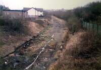 Looking from near Paisley Abercorn station round the tight curve to Arkleston Junction. The track was lifted a few months earlier.<br><br>[Ewan Crawford //1987]