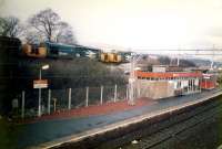 A double headed empty bauxite train comes off the West Highland Railway at Craigendoran.<br><br>[Ewan Crawford //1987]