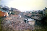 Just west of Craigendoran the now singled line slews from the former up line route to the former down line. The Pagoda signalbox once stood here between the West Highland Railway (left) and Helensburgh lines (seen here). Railwaymens cottages still stand.<br><br>[Ewan Crawford //1987]