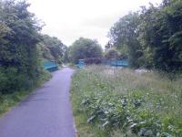 Looking west, this shows the approach to Kilbarchan Station and the Road bridge it crosses. The station had an island platform, platform 2 being off to the right.<br><br>[Graham Morgan 14/06/2006]