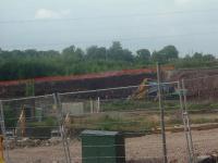 Looking North, this shows part of the retaining wall for the station that led to rail bridges across the Johnstone/Houston road. Now demolished and flattened, the site forms part of development for a supermarket.<br><br>[Graham Morgan 21/07/2006]