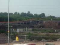 Looking North, this the walls of the station partially demolished, along with part of the embankment partially stripped away. Now demolished and flattened, the site forms part of development for a supermarket.<br><br>[Graham Morgan 25/07/2006]