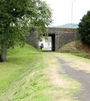 A 19th Century aperture in a (originally) 15th century structure. View west on the south bank of the Tweed in Peebles in August 2006 along the trackbed running from the former Tweed railway bridge [see image 6076] towards the site of the Caledonian station.<br><br>[John Furnevel 26/08/2006]