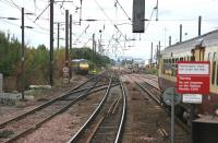 View West from Haymarket station on 5 August 2006 with Haymarket depot in the background. On the left a westbound GNER London Kings Cross - Glasgow Central service has just turned south towards Carstairs at Haymarket East Junction.<br><br>[John Furnevel 05/08/2006]