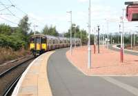 318265 stands in the sunshine alongside Rutherglen platform 1 on 15 August 2006 awaiting its scheduled departure time with a service to Dalmuir.<br><br>[John Furnevel 15/08/2006]