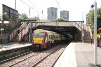 Leaving Duke Street, Glasgow, in August 2006, westbound SPT liveried 334040 enters Duke Street Tunnel.<br><br>[John Furnevel 14/08/2006]