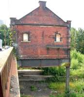 View south along Benalder Street on 27 August 2006, showing the surviving Partick Central station building perched over the remains of its platforms. <br><br>[John Furnevel 27/08/2006]