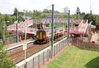 A terminating service from Glasgow Central arrives at Whifflet station on 24 August 2006. View south east towards Whifflet South Junction, which lies just beyond the end of the platform.<br><br>[John Furnevel /08/2006]