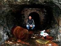 Inside the void looking toward the exit of the refuge to the Tunnel... Notice the oil drum amoungst other debris. PS not me in picture but kind permission granted.<br><br>[Colin Harkins 17/04/2006]