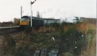 Steam heat 47 leaves Forres in 1977 with an Aberdeen service. It it has started to snow.<br><br>[Brian Forbes /12/1977]