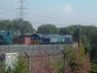 DRS Class 66 66410 at Elderslie collecting freight at WH Malcolms freight terminal for movement to Grangemouth.<br><br>[Graham Morgan 16/10/2006]