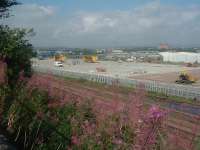 Work continuing on WH Malcolms Elderslie Freight Terminal. The whole area is being concreted and extra lines added so that longer freight trains can use the site<br><br>[Graham Morgan 16/08/2006]