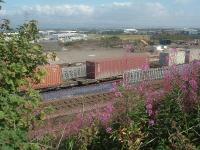 Loaded flatcars at WH Malcolms Elderslie Freight Tertminal. Note the gate in the new fence put in place by WH Malcom to help make site more secure.<br><br>[Graham Morgan 16/08/2006]