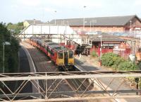 Scene at Neilston on 20 August 2006, as a class 314 EMU, resplendent in orange and black livery, runs into platform 1 from the turnback siding ready to head back to Glasgow Central.<br><br>[John Furnevel 20/08/2006]