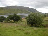 Railcar 18 slips along by Lough Finn.<br><br>[Ben Torsney //2006]