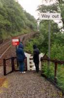 Soggy passengers look east at Falls of Cruachan. Note semaphore signal part of Andersons Piano - a rockfall protection system.<br><br>[Ewan Crawford //1988]