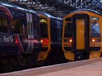 A very busy period at Dundee on 25 August, with 3 158s joined by a Virgin 221 on platforms 2 and 3 and another pair of 158s stabled in the sidings.<br><br>[Adrian Coward 25/08/2006]