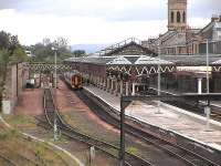 Platform 7 at Perth, a train for Inverness sits alongside the carriage washery. That line was once a through goods loop<br><br>[Brian Forbes 22/05/2006]