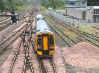 The 1140 Edinburgh - Inverness passes the Perth signal centre (on right) and under St.Leonards Bridge<br><br>[Brian Forbes 22/05/2006]