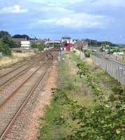Southern approach to Carnoustie station in August 2006. The original station, replaced in 1900, was located on this side of the level crossing.<br><br>[John Furnevel 12/08/2006]