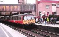 Motherwell Platform 2, a Lanark - Dalmuir service stops to pick up a large number of passengers.<br><br>[Brian Forbes /03/2002]