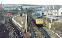 1215 Dunblane - Edinburgh leaves on time. These trains arrive in Dunblane on the left hand platform.<br><br>[Brian Forbes /04/1986]