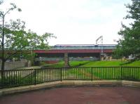 A Cumbernauld - Motherwell service, photographed shortly after leaving Coatbridge Central in August 2006 and crossing the plate girder bridge over the Monkland Canal basin.<br><br>[John Furnevel 29/08/2006]