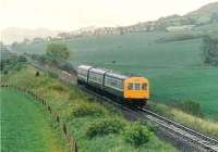 It is a very wet saturday, as this 101 leaves The Woodriffe houses of Newburgh behind.  It heads for Perth. <br><br>[Brian Forbes /09/1985]