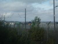 DRS Class 66 66403 at WH Malcolms Elderslie Freight Terminal offloading freight<br><br>[Graham Morgan 06/09/2006]