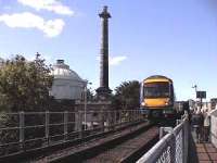 a 170 for Dundee slowly enters the single track metal viaduct accross the River Tay. To the left is the Fergusson Art Gallery.<br><br>[Brian Forbes 09/09/2006]