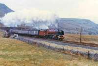 46229 storms over Ais Gill Summit with southbound Cumbrian Mountain Express.<br><br>[John Robin 26/03/1983]