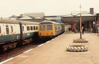 A Cravens DMU leaves Stirling for the north, past a service to Edinburgh.<br><br>[Brian Forbes //1977]