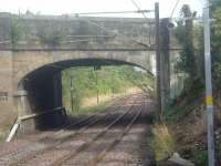 Looking east from Johnstone station, this shows the exact location where the Johnstone Curve from Cart Junction (next to the yellow triangle on the pylon) met the main line to Ayrshire. The remains of the some of the trackbed also still exist<br><br>[Graham Morgan 12/09/2006]