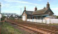 Errol station looking south towards the level crossing in September 2006. As well as the internal coffee shop there are also tables located behind the fenced off area on the platform itself. <br><br>[John Furnevel 04/09/2006]