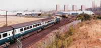 47.709 reaches the top of Cowlairs Incline, with an express to Edinburgh, new mark 3 stock in tow. The 101 is  heading downhill to Queen Street.<br><br>[Brian Forbes /04/1987]