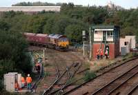 Empties from Ironbridge Powerstation are held at Madeley Junction. The Shrewsbury-Wolverhampton line is being partly resignalled. View looks west.<br><br>[Ewan Crawford 13/09/2006]