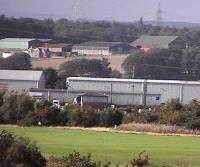 Long shot of Larbert Junction box from the footbridge at Camelon. The golf course is Falkirk Tryst. <br><br>[Brian Forbes 19/09/2006]