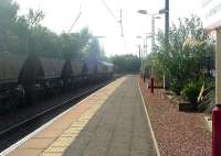 66081 of EWS races through Johnstone with empty coal hoppers heading for Hunterston.<br><br>[Graham Morgan 21/09/2006]