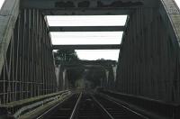 View from the level crossing at Hawarden Bridge looking south over the River Dee at a train stopped at Shotton.<br><br>[Ewan Crawford 15/09/2006]