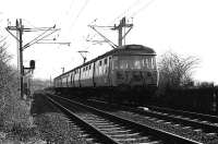 A Helensburgh service heads west from Cardross at Geilston LC in 1974 with AM3 unit no.011. <br><br>[John McIntyre /03/1974]