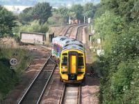 A morning Bathgate - Newcraighall train comes off the branch at Newbridge Junction in September 2006 and joins the main Glasgow - Edinburgh line.<br><br>[John Furnevel 24/09/2006]