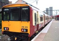 Newly painted classs 318 at Bellgrove heading for Springburn<br><br>[Colin Harkins 22/10/2005]