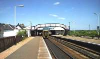 Looking north on 06 July 1991 as an Inverness bound Class 158 Express Sprinter calls at Aviemore.<br><br>[John McIntyre 06/07/1991]