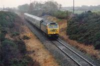 Inverness - Aberdeen approaching the viaduct over the Findhorn to the west of Forres. April showers!<br><br>[Brian Forbes //]