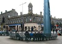 A <I>discussion group</I> meets at the foot of Leith Walk in September 2006 opposite the shell of Leith Central - the largest new station built in Britain in the 20th Century. Over on the left, Queen Victoria (God bless Her) watches over proceedings.<br><br>[John Furnevel 14/09/2006]