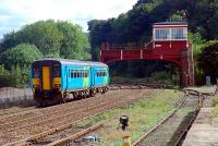 Eastbound DMU approaching Hexham signalbox.<br><br>[Ewan Crawford 26/09/2006]