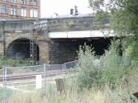 Bridge carrying Cumbernauld Road ... A siding of sorts ran through the arched portal.<br><br>[Colin Harkins 29/09/2006]