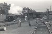 View north at Haghill Junction in June 1958. Parkhead V1 67621 has just left Alexandra Parade station with a  Springburn - Scotstounhill train. [See image 23122]<br><br>[G H Robin collection by courtesy of the Mitchell Library, Glasgow 05/06/1958]